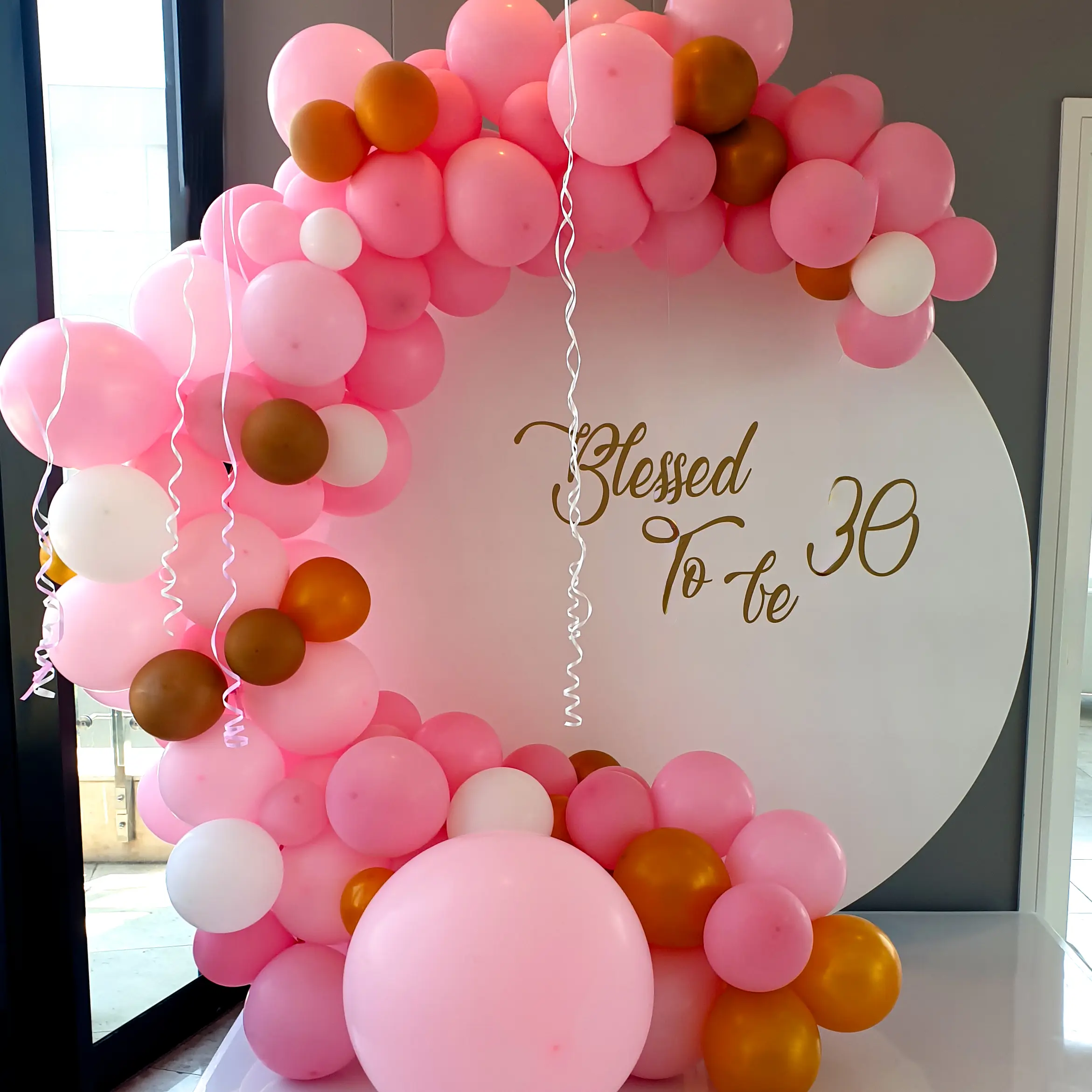 Pink, white and gold balloon garland for a 30th birthday